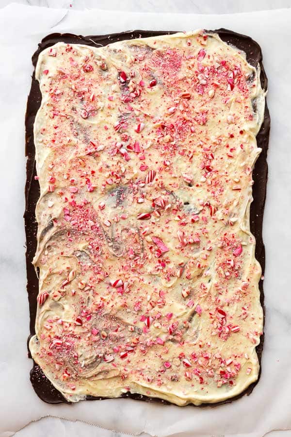 This Peppermint Bark is an easy Christmas candy, made with dark chocolate, white chocolate, peppermint extract and crushed candy canes! #peppermint #candy #chocolate #christmas overhead image of peppermint bark before cutting