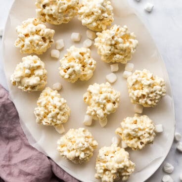 overhead image of popcorn balls on white platter