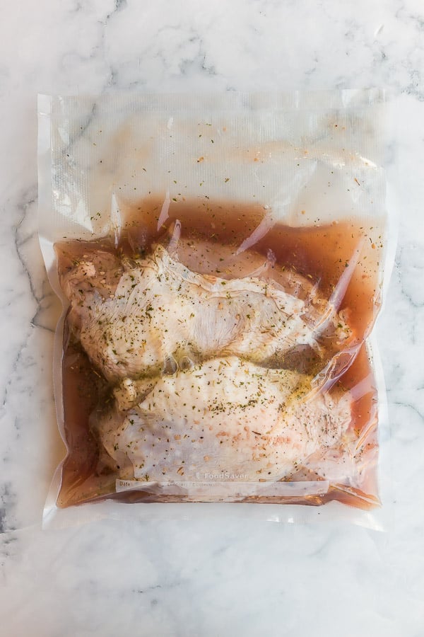 vacuum sealed turkey breasts in marinade