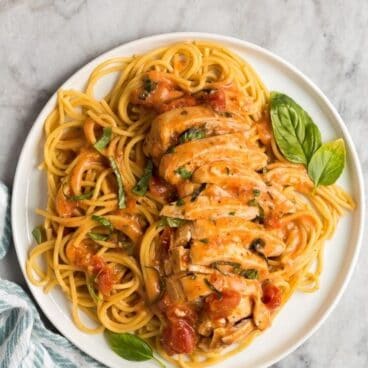 chicken on bed of spaghetti