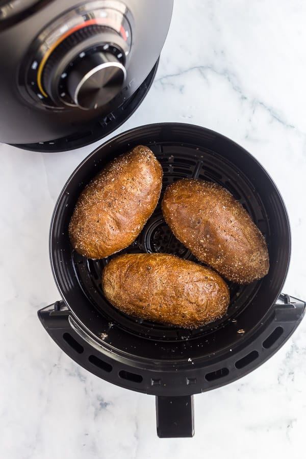 baked potatoes in basket of air fryer