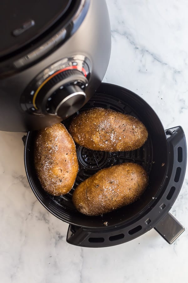 salted potatoes going into air fryer