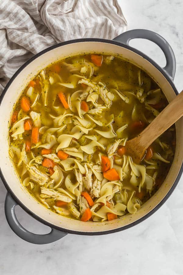 overhead image of chicken noodle soup in dutch oven