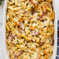 overhead image of kielbasa pasta bake in white baking dish