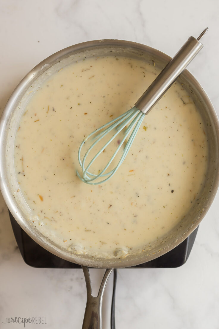 finished pasta bake sauce in stainless steel skillet with whisk