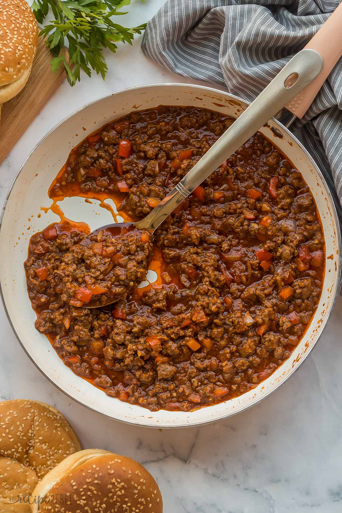 sloppy joe filling in a white pan with spoon