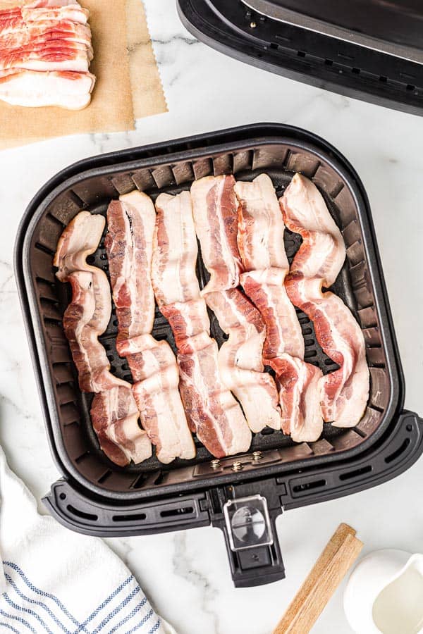 raw bacon slices in air fryer basket