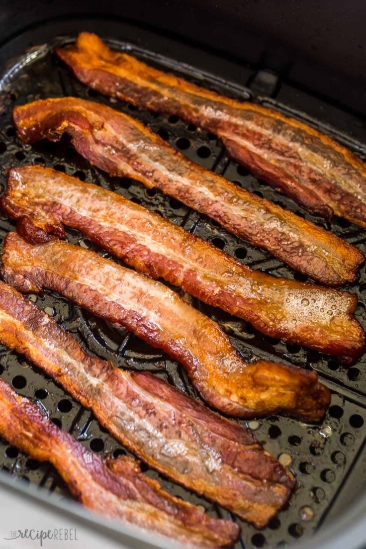six strips of bacon in an air fryer basket