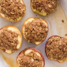 overhead image of halved baked apples with streusel
