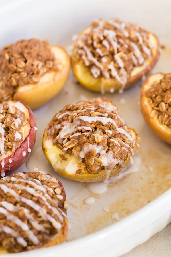 Halved baked apples with streusel and glaze