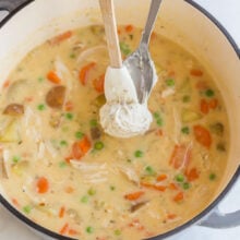 using a spoon and a spatula to make dumplings on top of stew