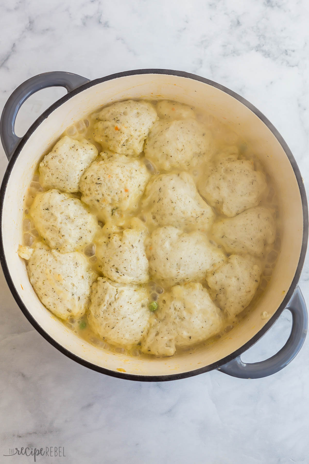 overhead image of pot with dumplings puffed after the lid was removed