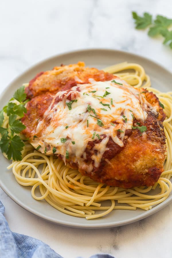 chicken parmesan on plate with spaghetti