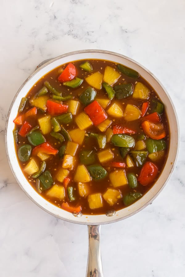 overhead image of sweet and sour sauce in white pan