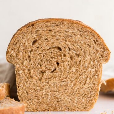 close up of whole wheat bread loaf sliced open