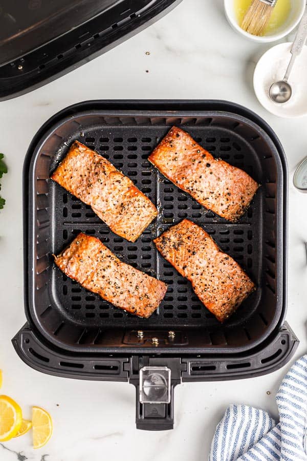 cooked salmon fillets in air fryer basket