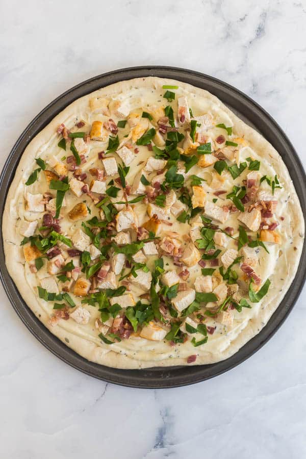 chicken alfredo pizza toppings on pizza dough