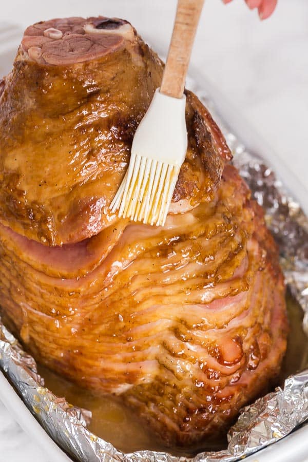 brushing glaze on warmed ham