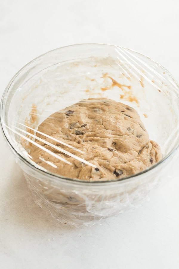 hot cross bun dough in glass bowl before rising