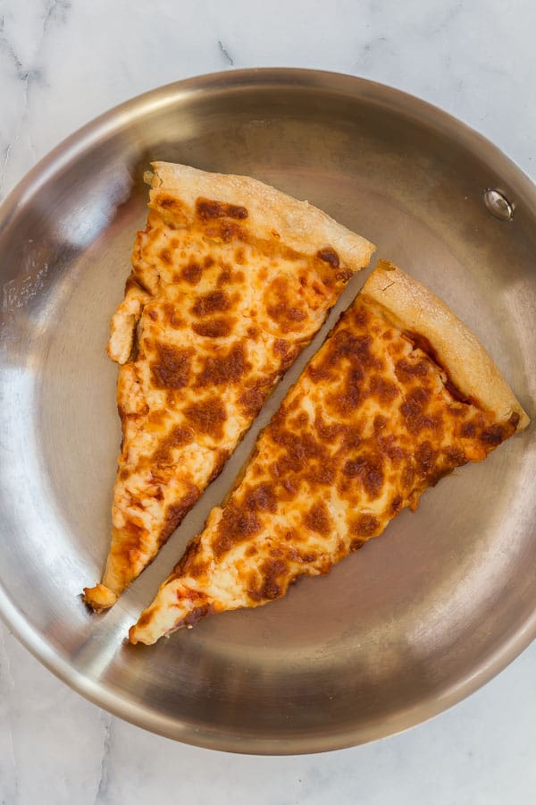 leftover pizza slices in skillet