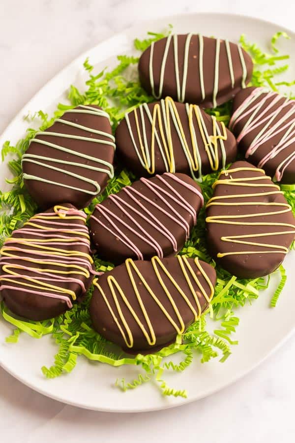 chocolate coated reeses easter eggs on white platter