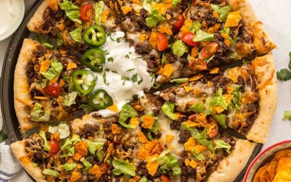 overhead image of taco pizza sliced