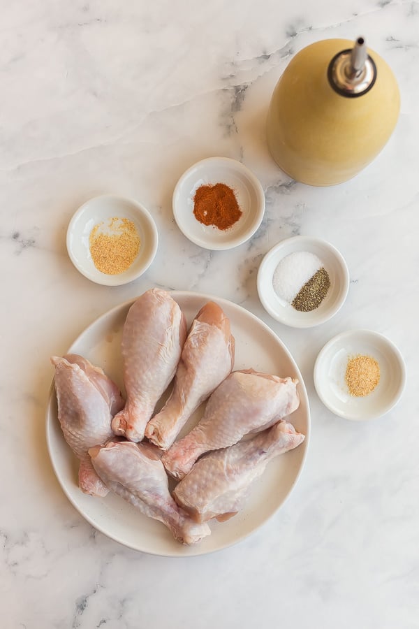 ingredients for air fryer chicken legs on white background