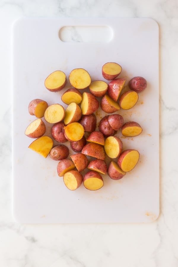 seasoned potatoes on cutting board