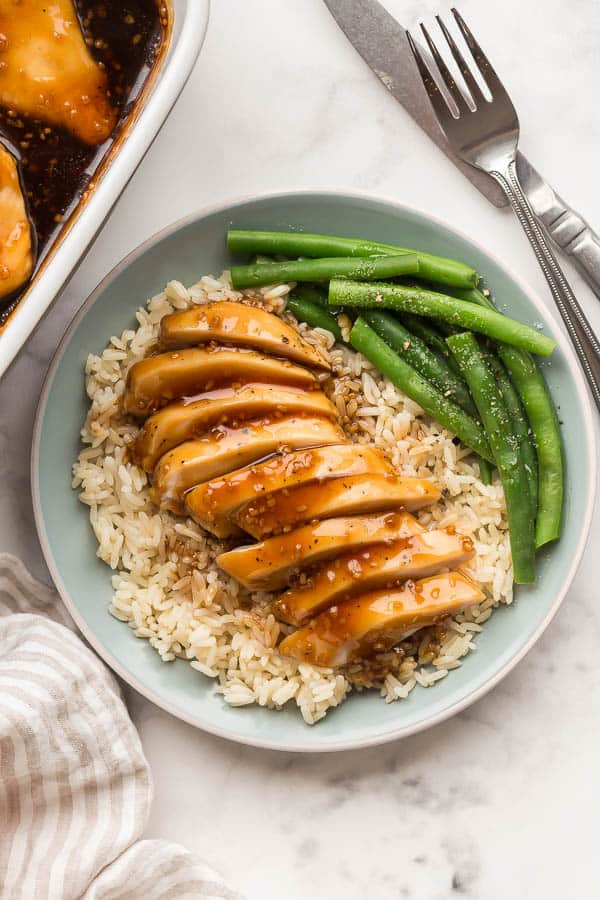 sliced honey garlic chicken on plate with rice