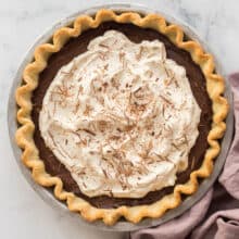 overhead image of chocolate cream pie with whipped cream and chocolate shavings
