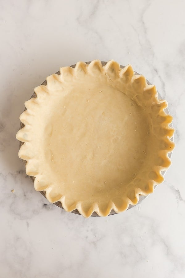 unbaked pie crust formed in pan