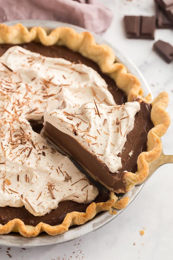 piece of chocolate pie being scooped out of pan