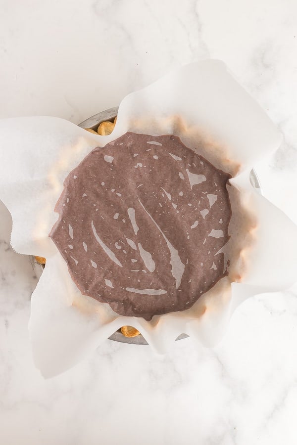chocolate pie with wax paper pressed onto the filling