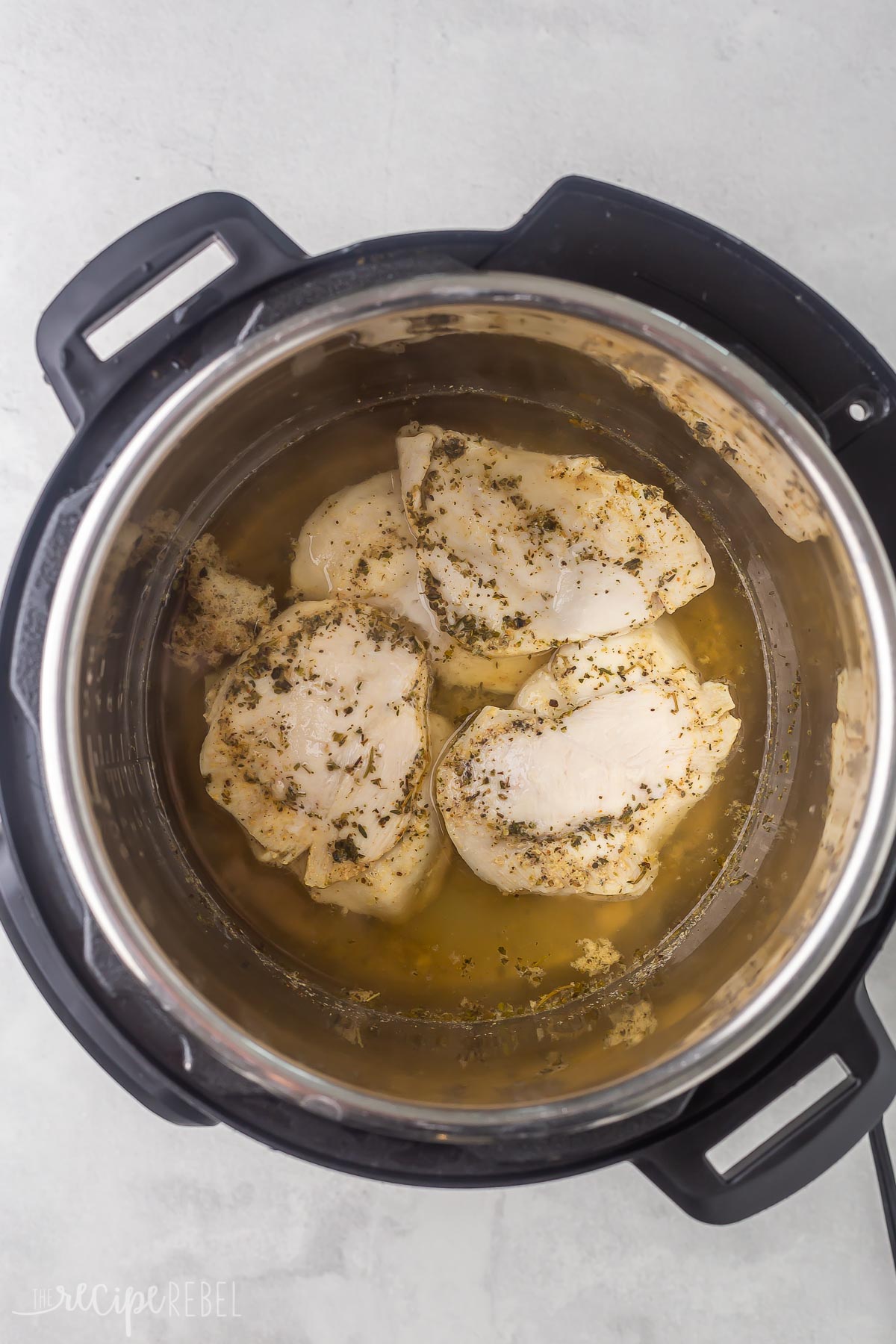 cooked chicken breasts in instant pot ready to shred.