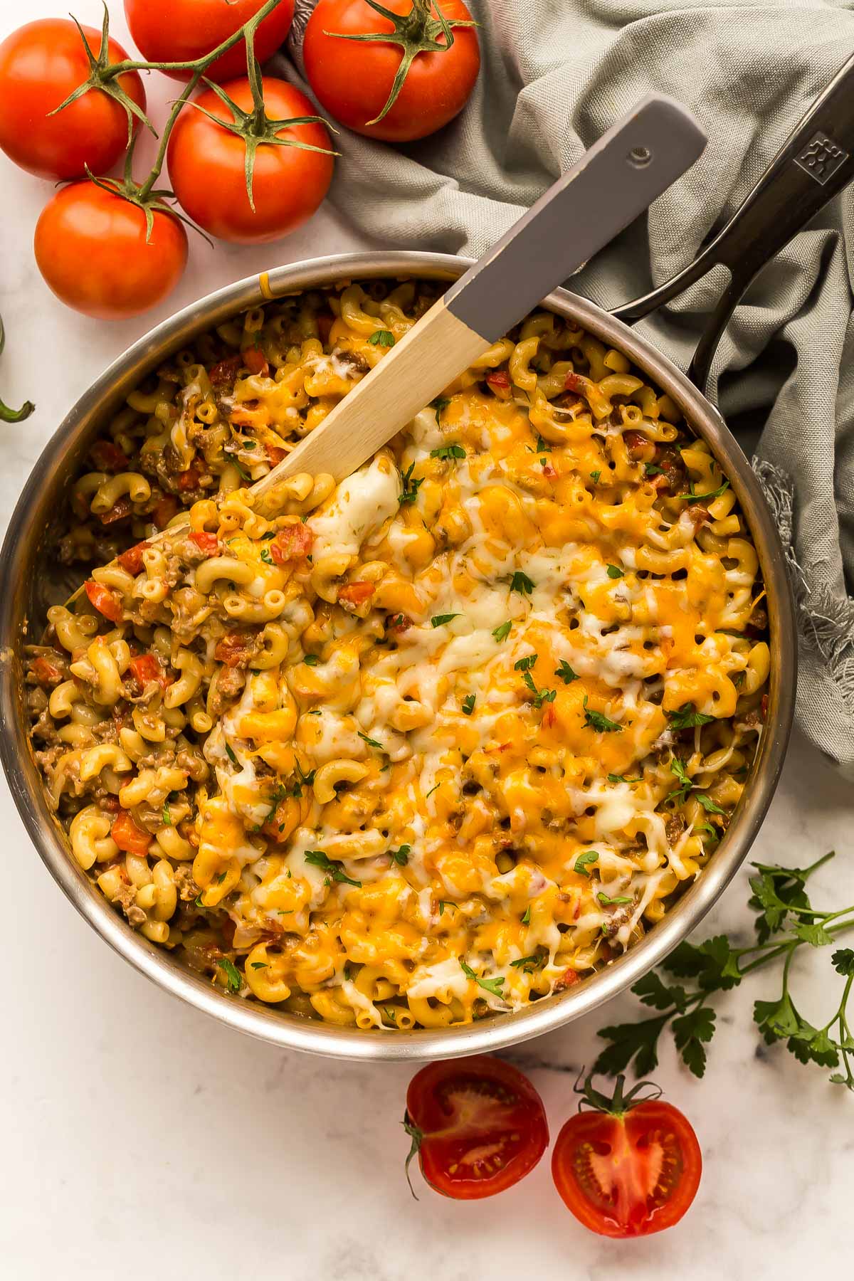 overhead image of pan of taco mac with wooden spoon stuck in