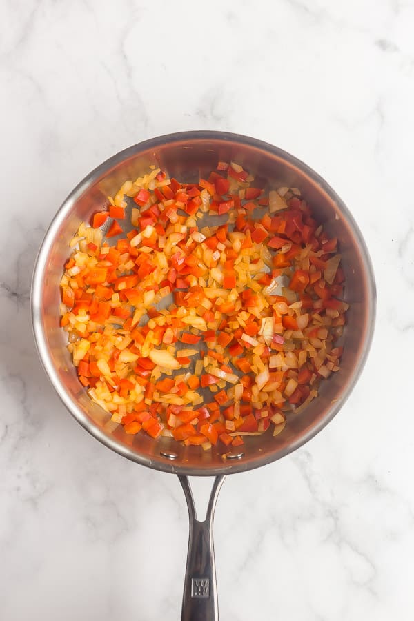 sauteed onions and peppers in skillet