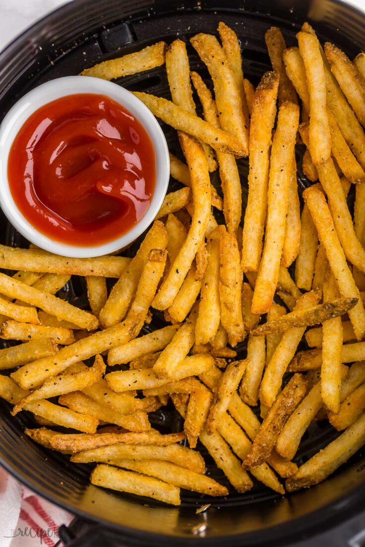 overhead image of air fryer frozen french fries in basket