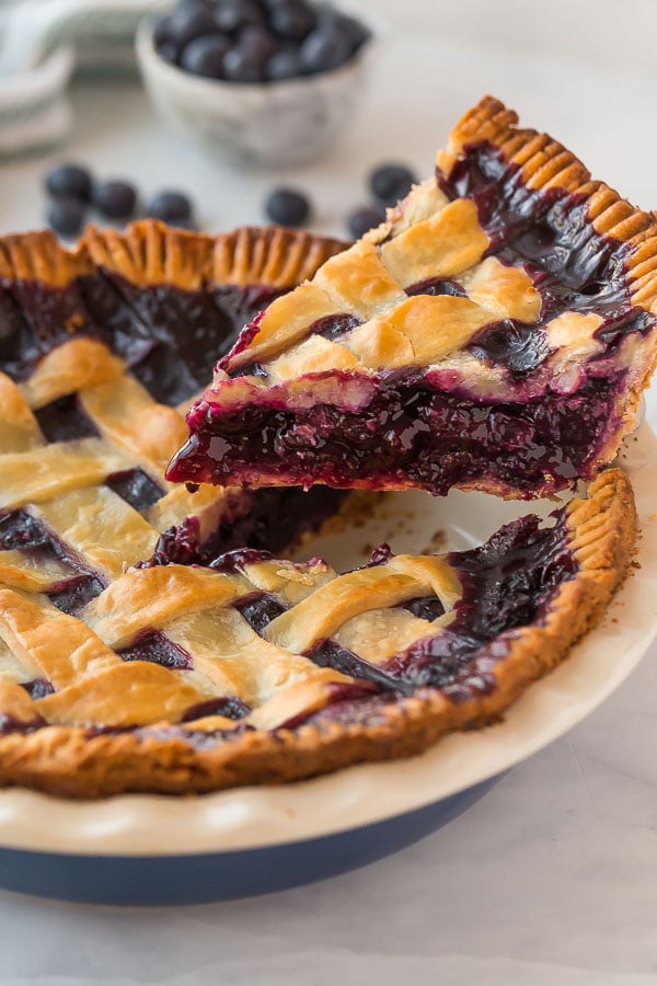 slice of blueberry pie being lifted out of pan