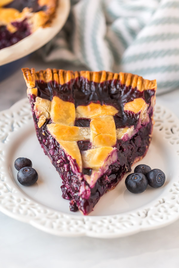 slice of blueberry pie on white plate