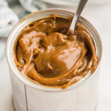 dulce de leche in can with spoon stuck in