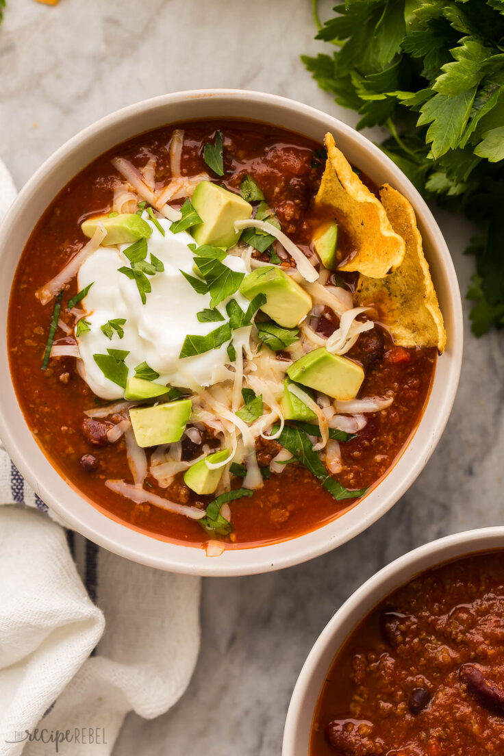 overhead image of bowl of instant pot chili with toppings