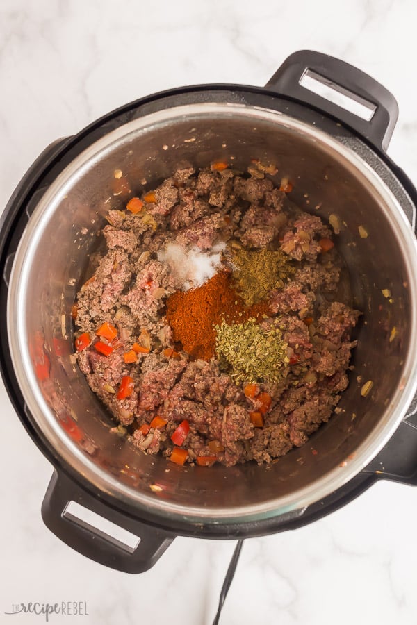 browned ground beef in instant pot with chili seasonings