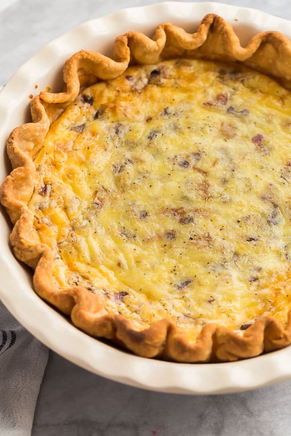 close up image of quiche lorraine in pie plate