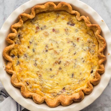 overhead image of quiche lorraine on marble background