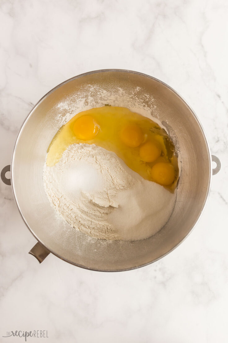 flour sugar salt and eggs in mixing bowl