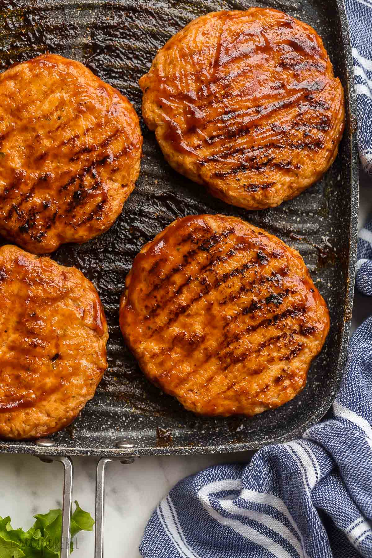 close up image of grilled chicken burger patties