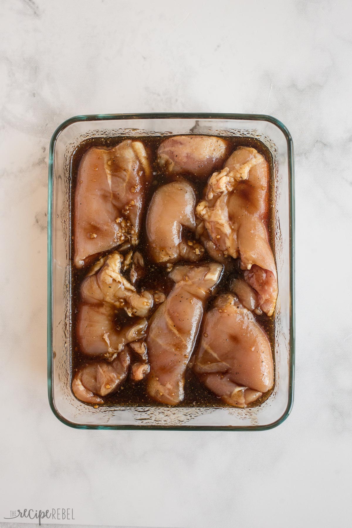 boneless chicken thighs in marinade before grilling