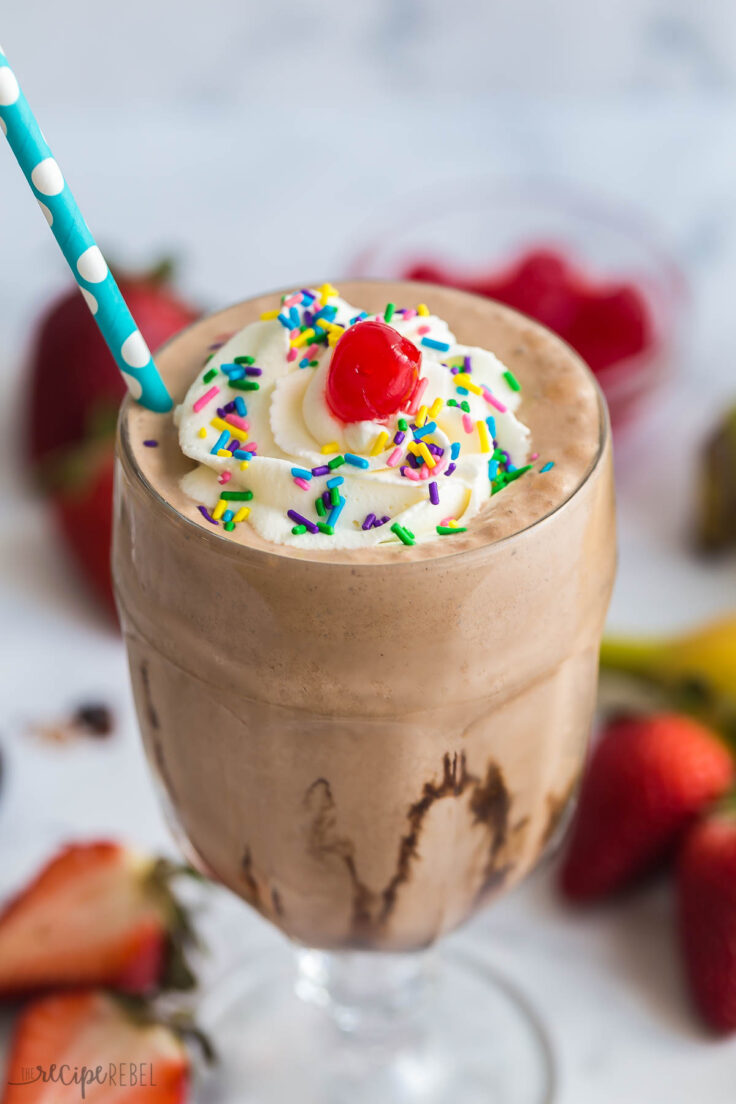 close up of chocolate milkshake with whipped cream