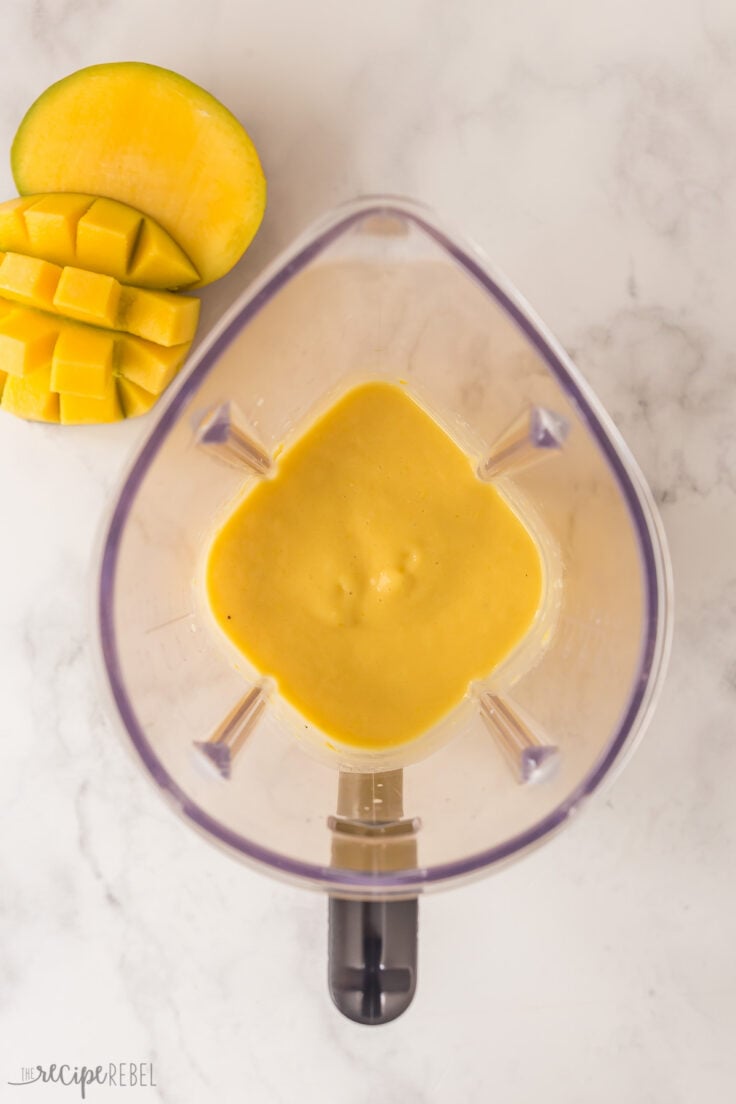 overhead image of mango smoothie in blender