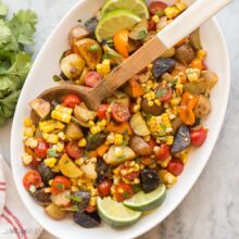 square image of southwest potato salad with wooden spoon stuck in